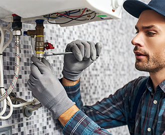 Plumber fixing a sink